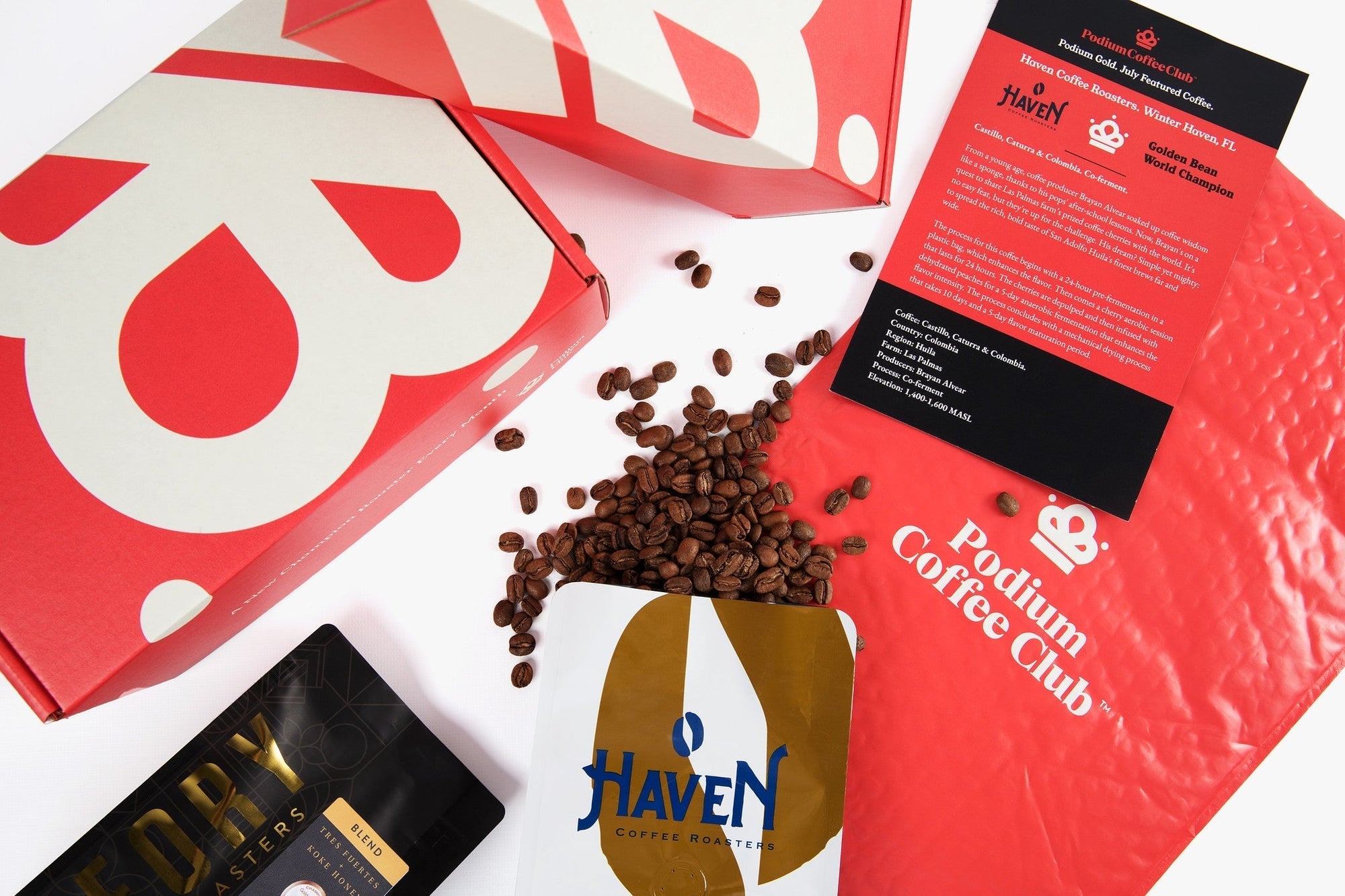 Podium Coffee Club packaging with coffee beans spilling out 