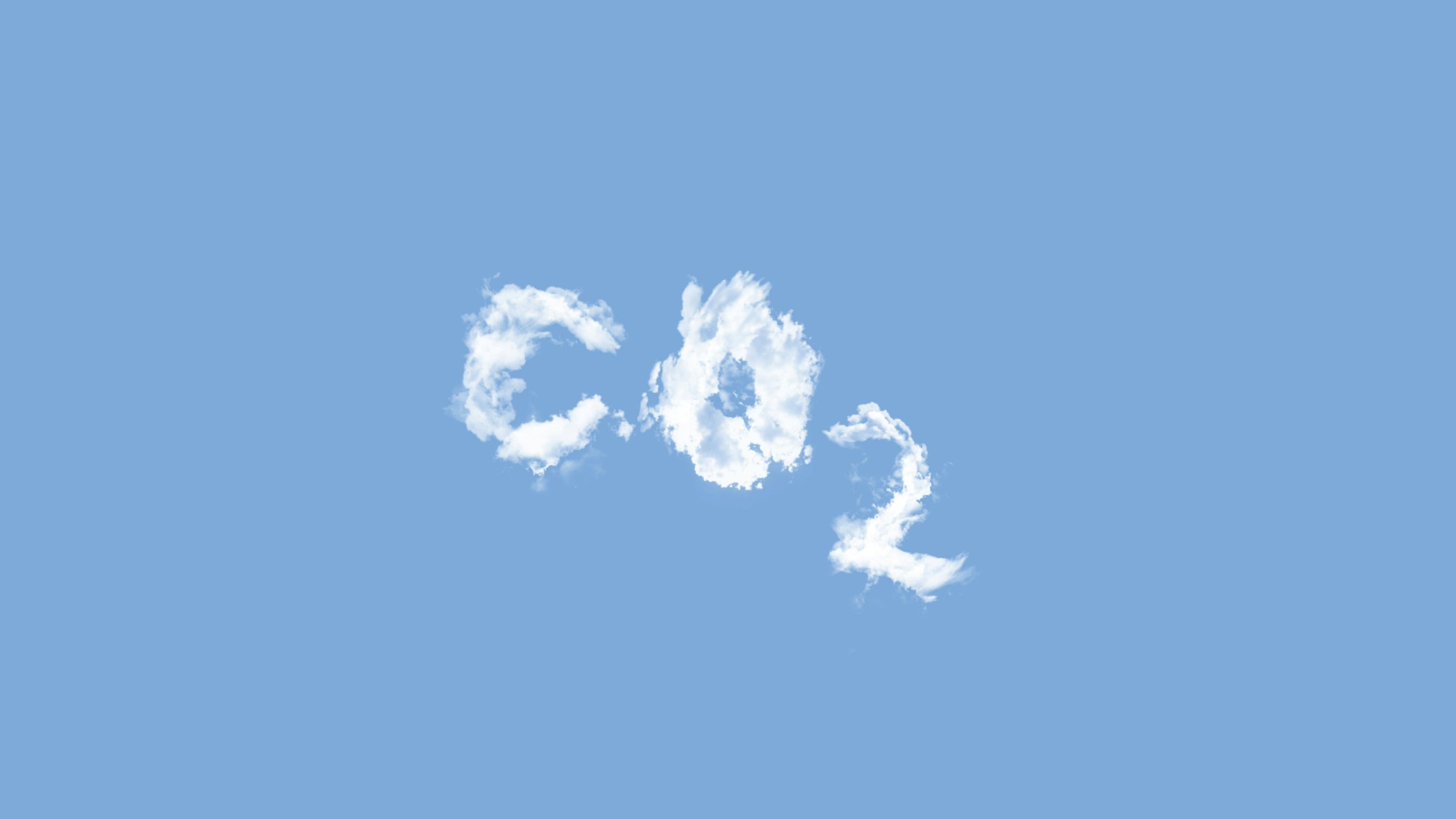 clouds spelling out 'CO2' against a blue sky
