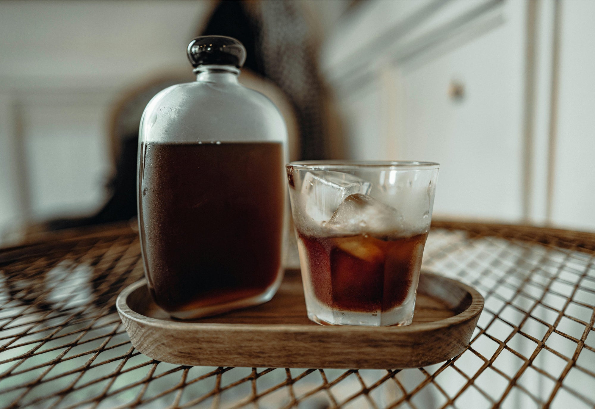 cold brew coffee sitting on a wooden tray