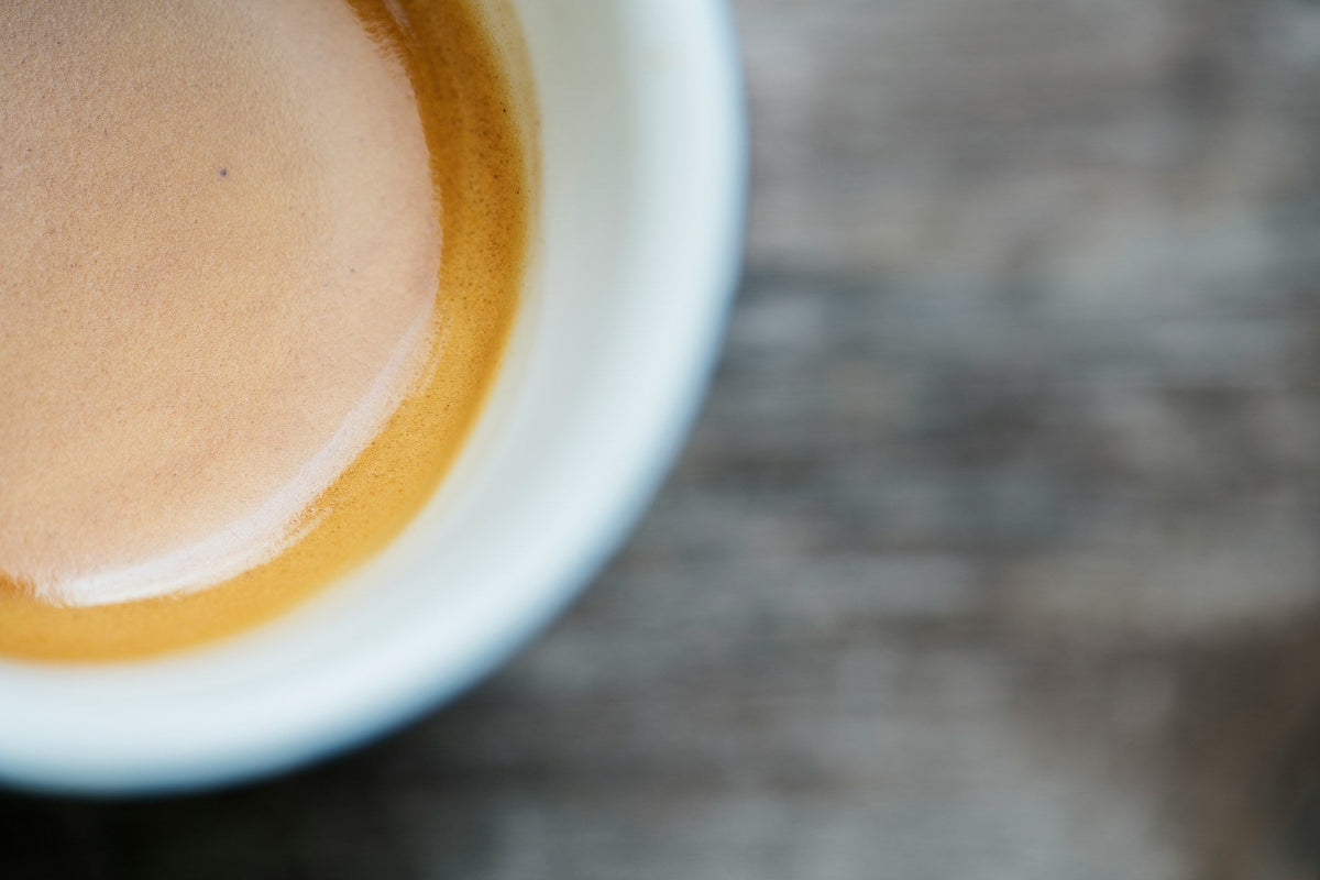 extreme close-up of espresso shot in espresso cup