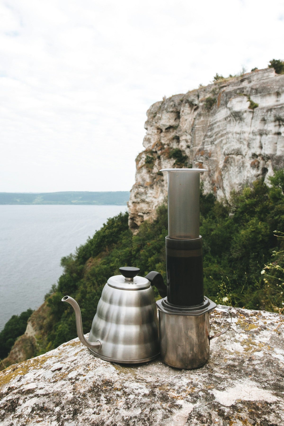 aeropress coffee maker on clifftop