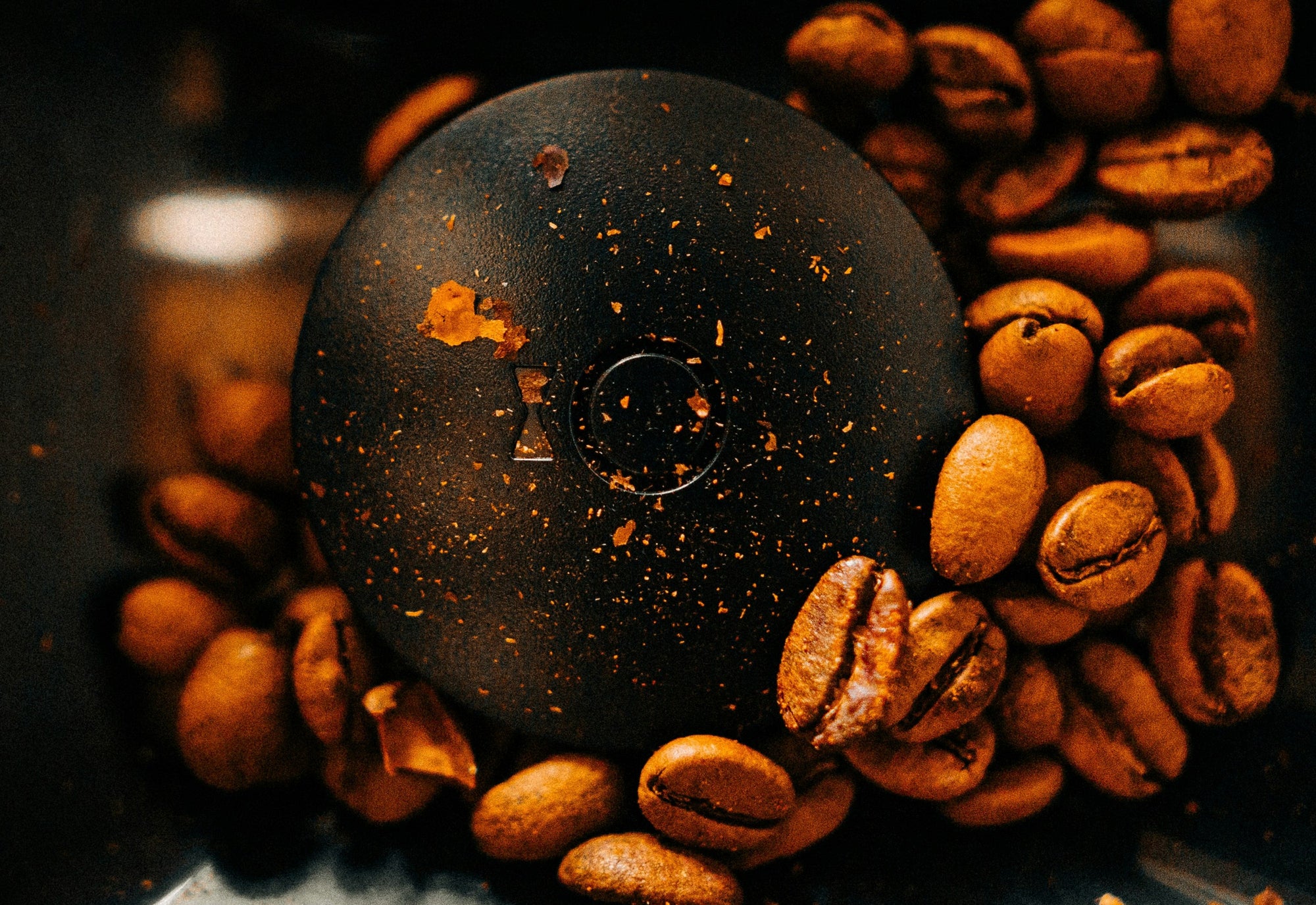 coffee beans swirling around in coffee grinder