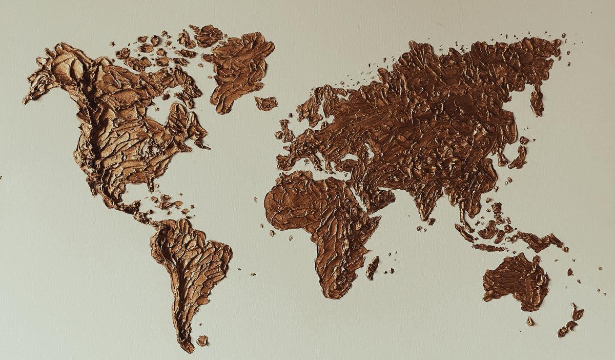 map of the world made up of coffee colored paint