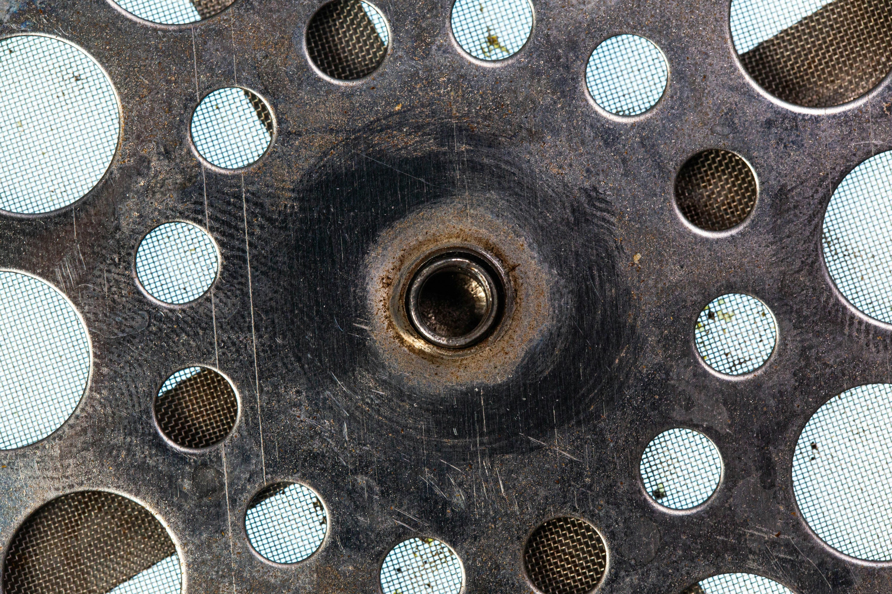 holes in metal revealing mesh metal patterns