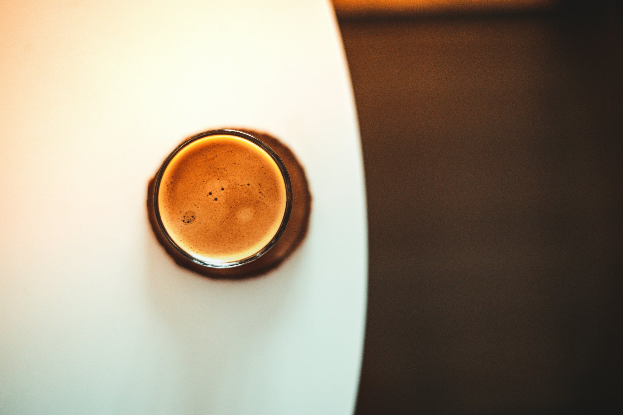 coffee cup sitting on round table