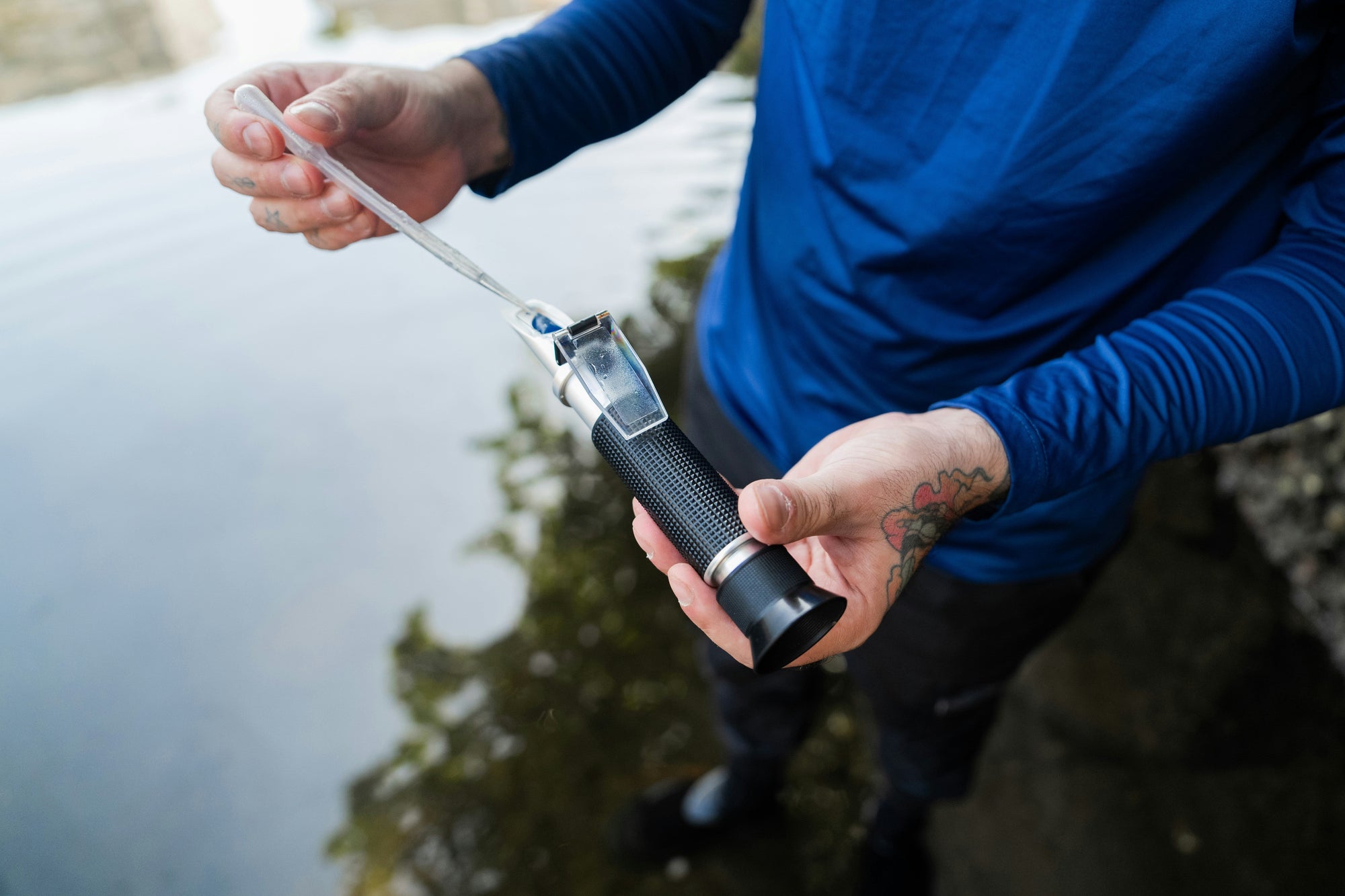 refractometer by river being held by person