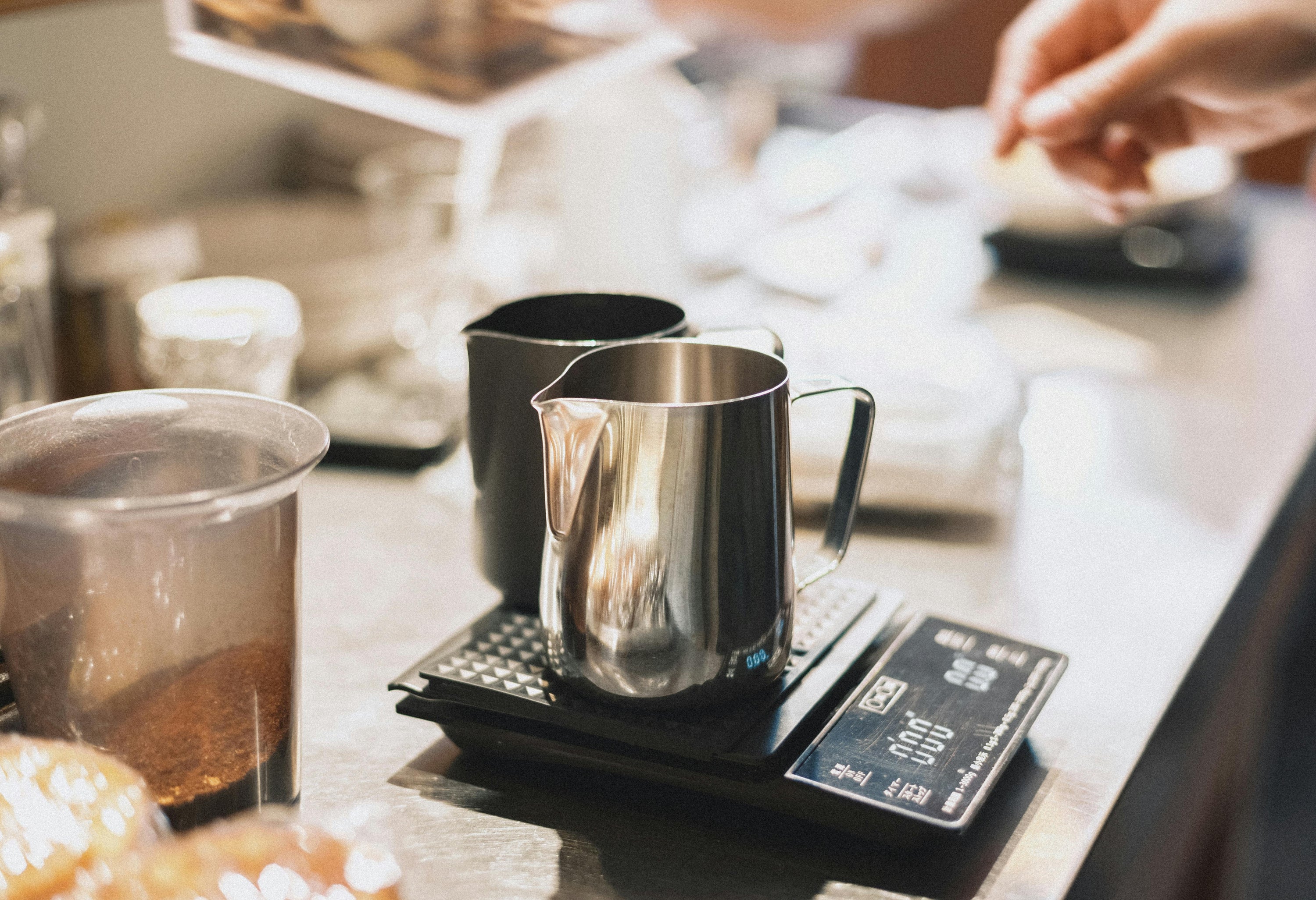 coffee scale with coffee jugs sitting on top