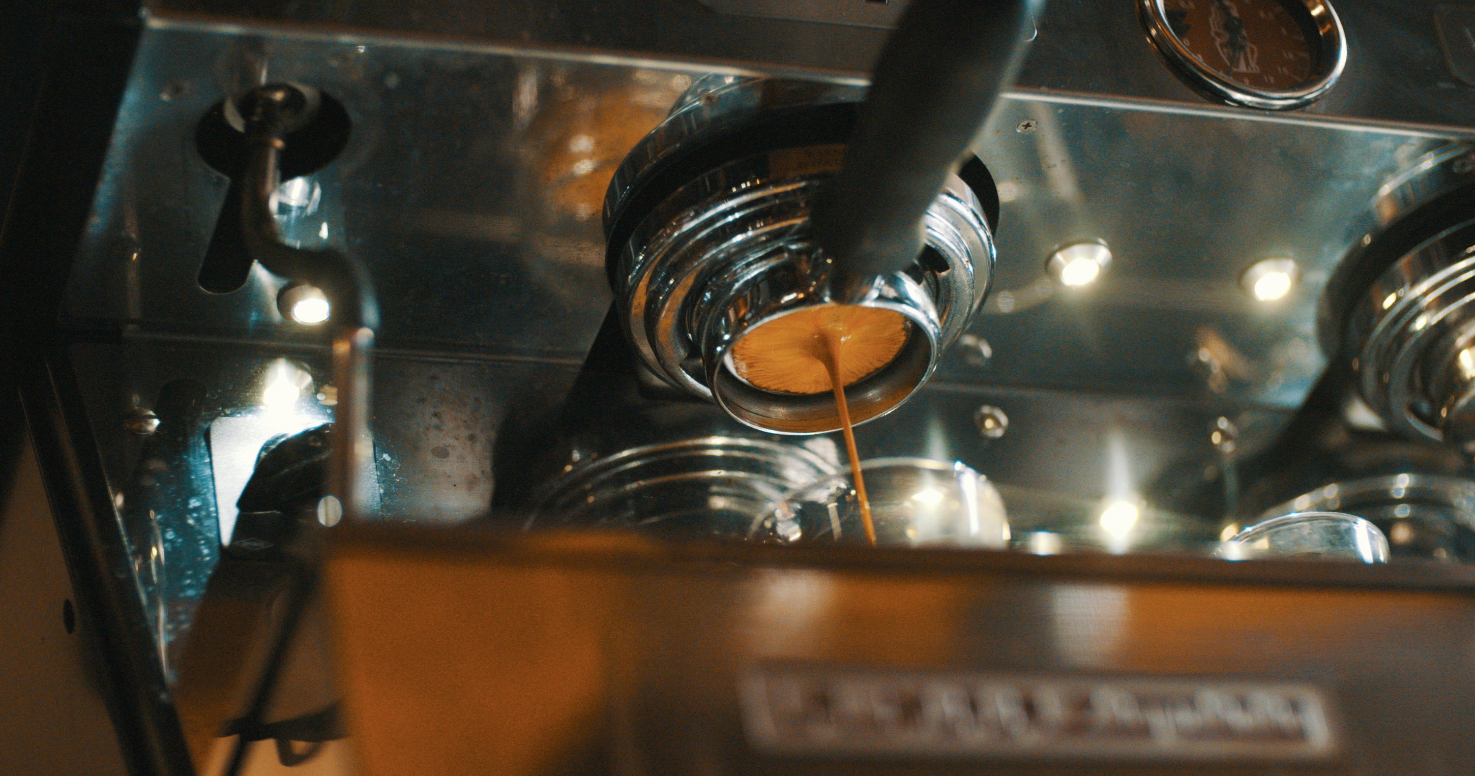 espresso machine with espresso shot being pulled