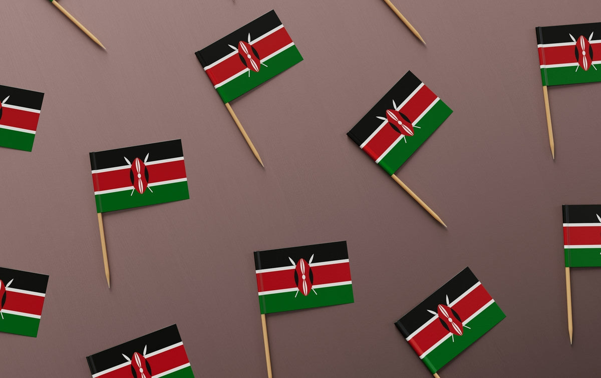 small Kenya flags on pale background