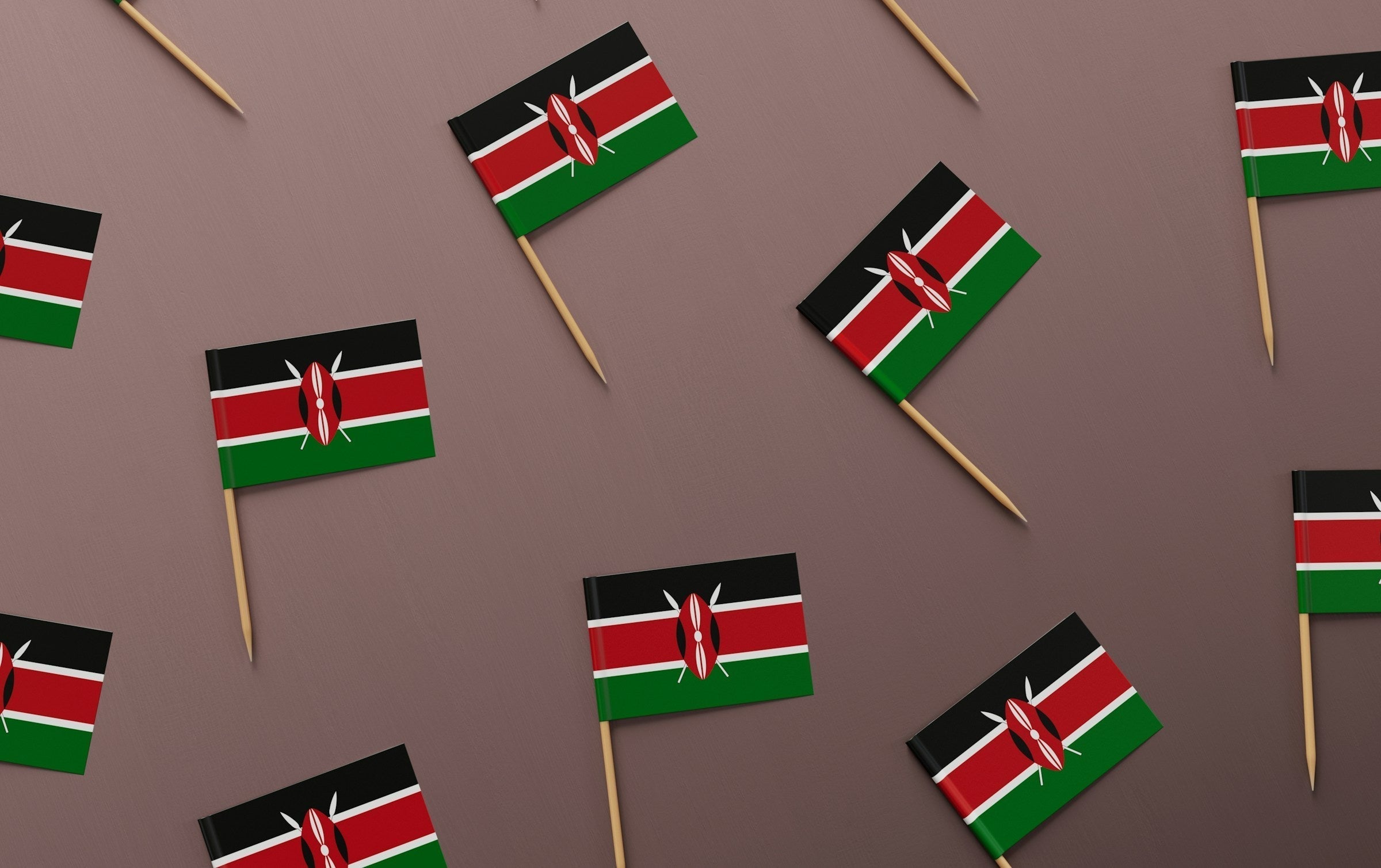 small Kenya flags on pale background