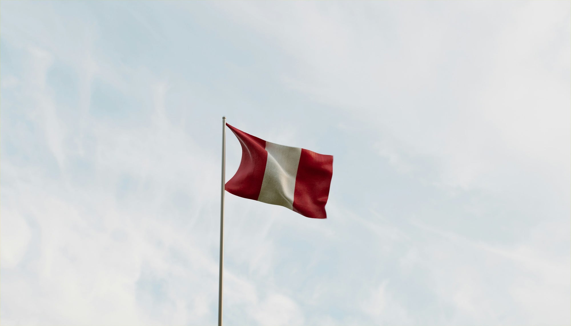 peru flag against a blue sky