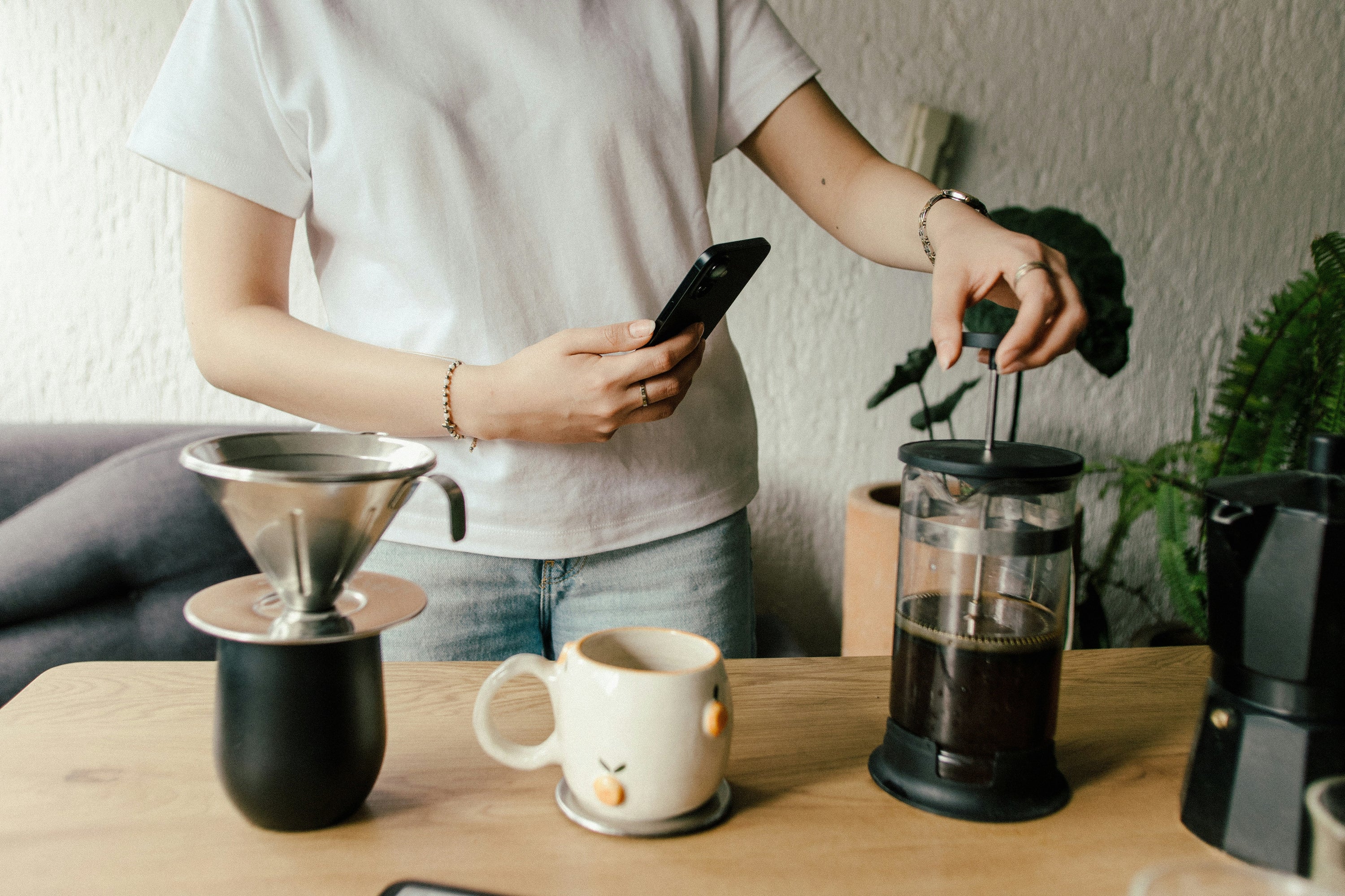 man plunging french press coffee maker