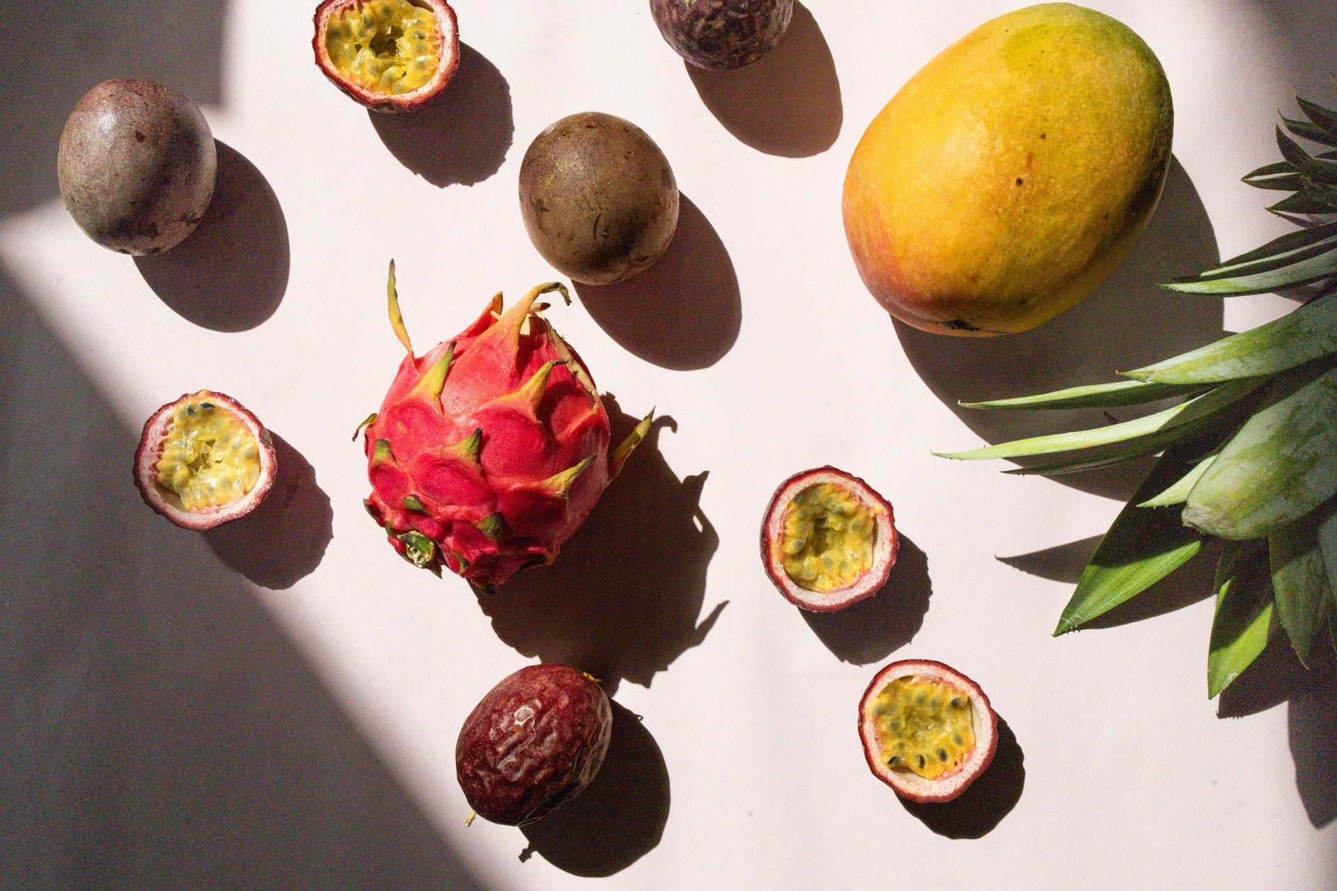 tropical fruits lying on a grey countertop