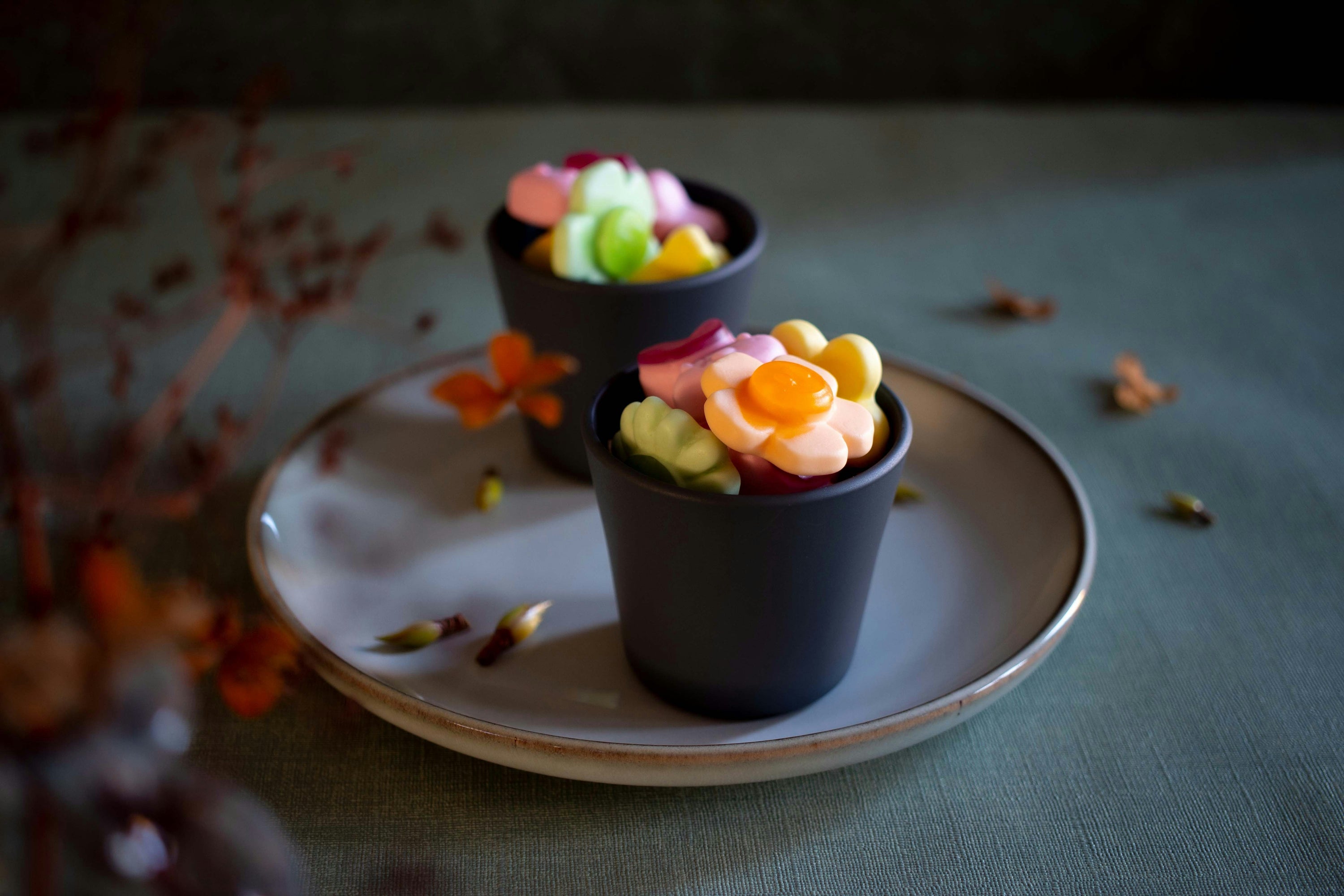two espresso cups full of sour candy